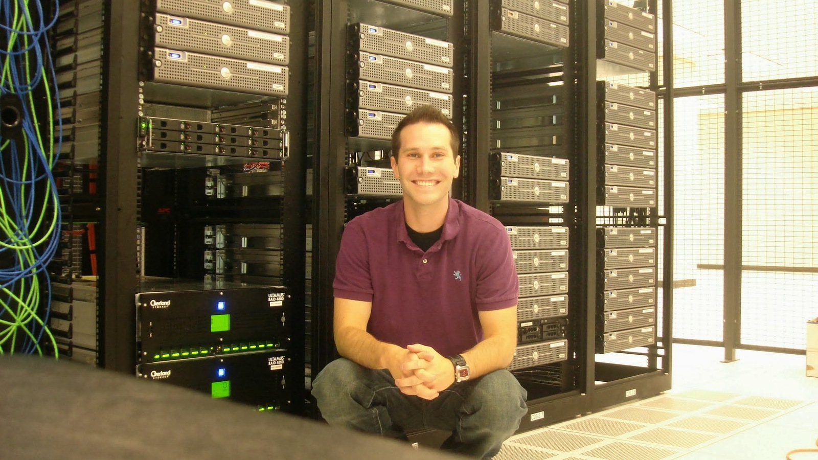 Chris Fischer seated in front of Beatport server racks in September 2008