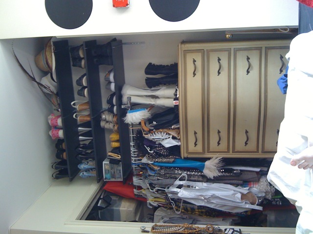 Floor-to-ceiling shoe shelves and a packed clothing rack in Chris Fischer's New York apartment after a late spring clean