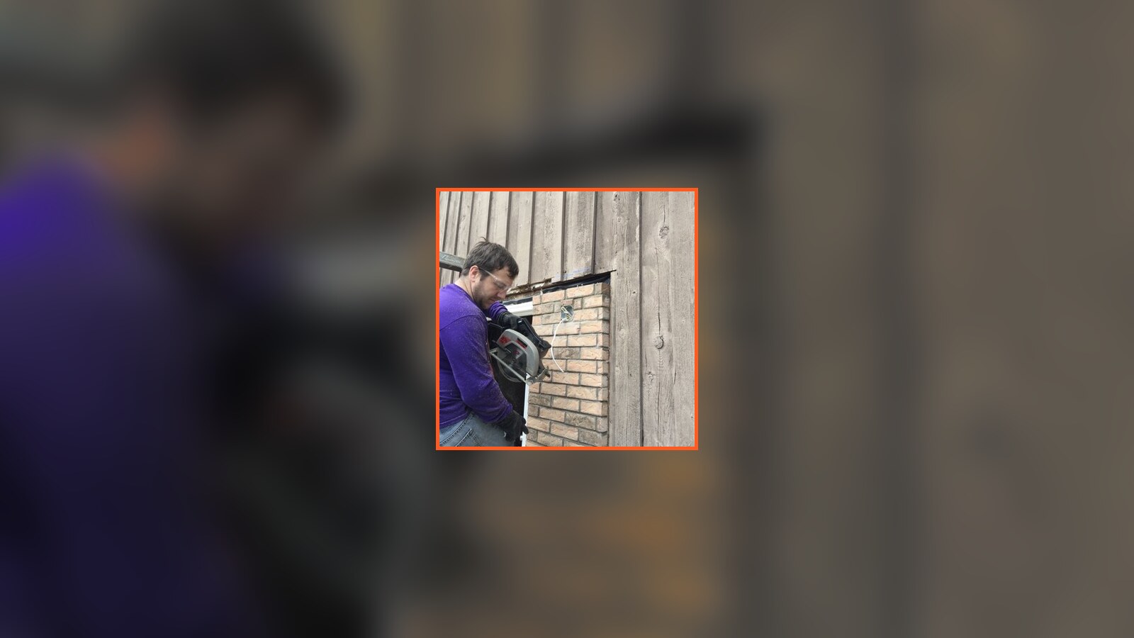 Chris Fischer cutting through the brick exterior of his childhood home during the October 2015 Indiana rebuild