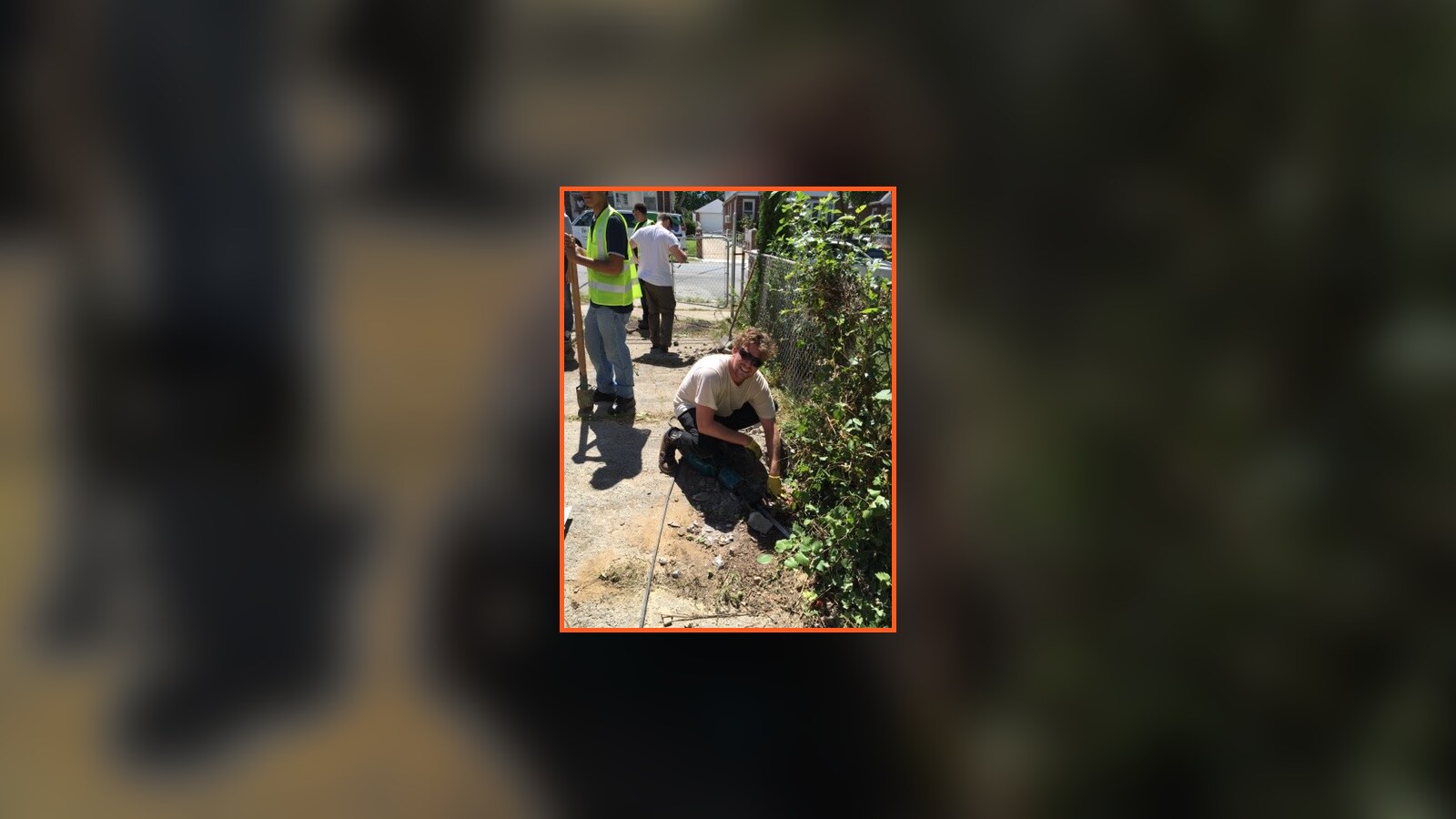 Volunteers working outside at a Habitat for Humanity site
