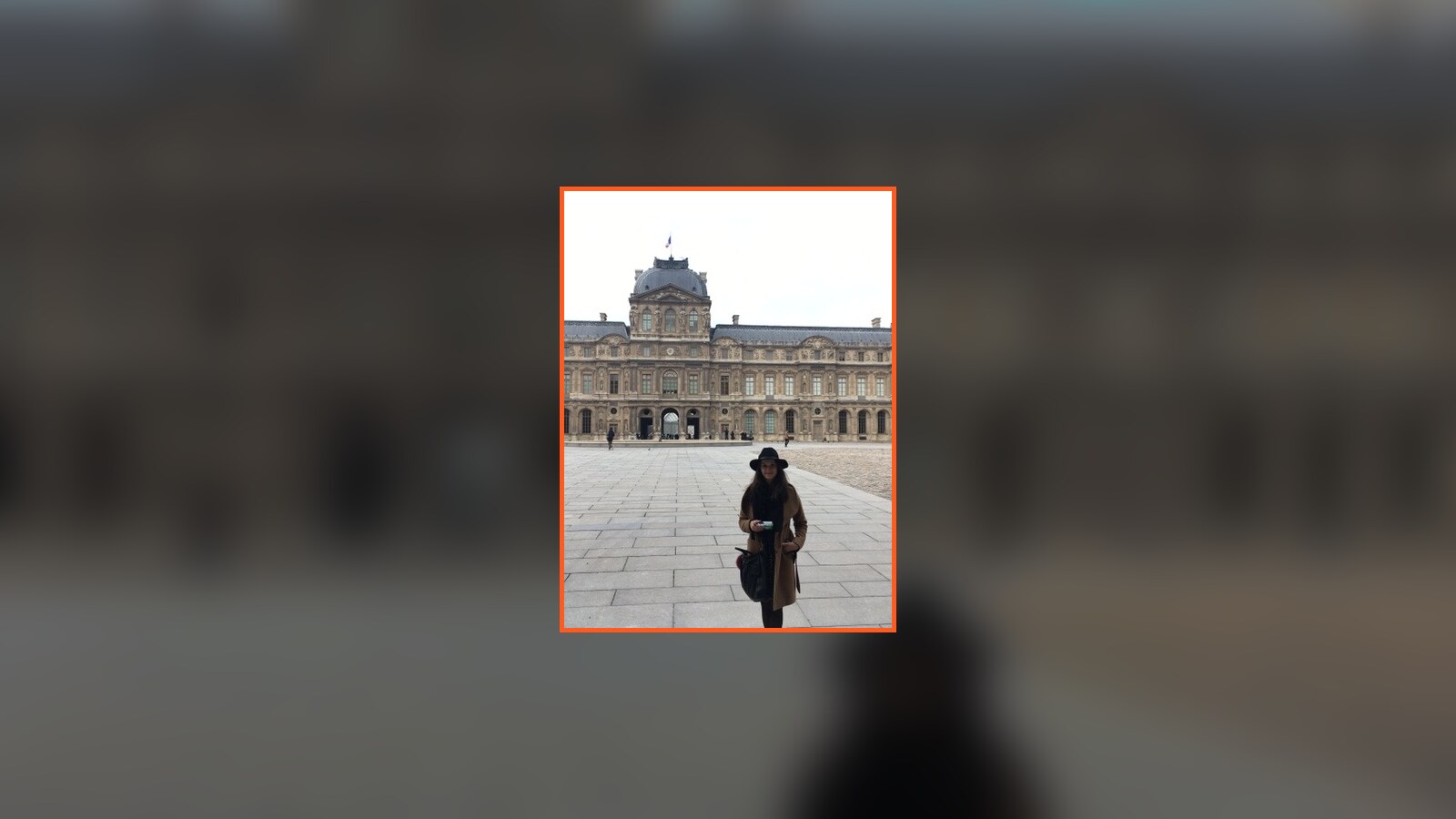 Amanda standing in the Louvre courtyard during our October 2016 trip to Paris