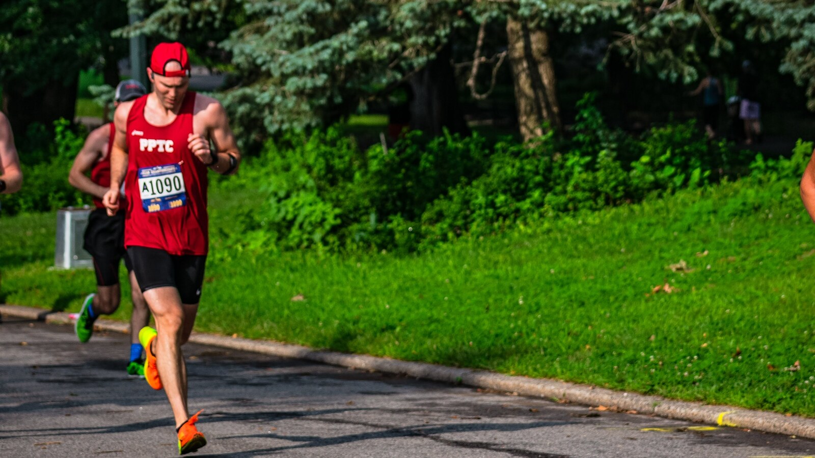 Chris Fischer racing in a red Prospect Park Track Club singlet during the 2018 NYRR Team Championships in Central Park