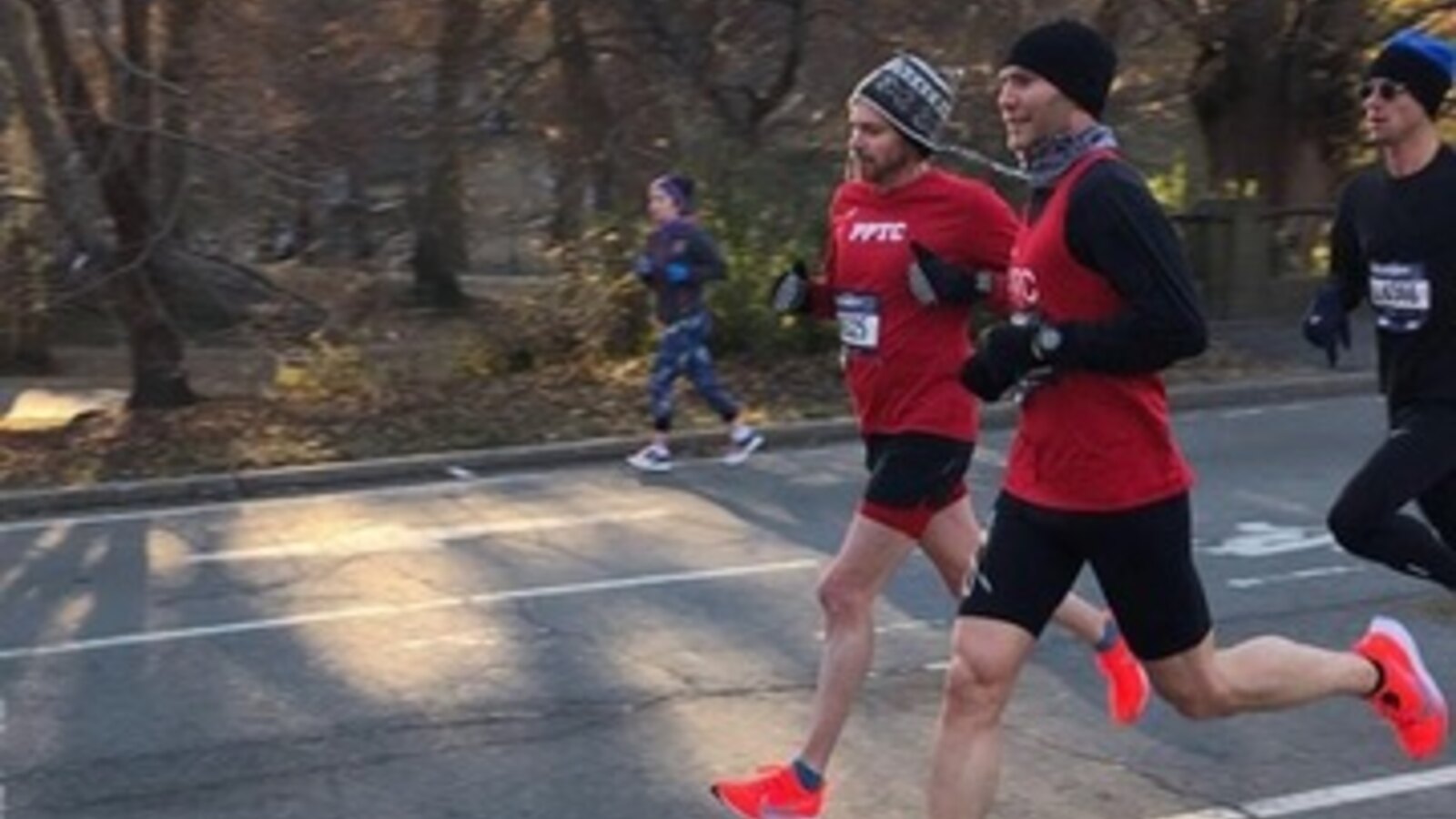 Chris Fischer racing the 2018 Ted Corbitt 15K in Central Park beside another Prospect Park Track Club runner