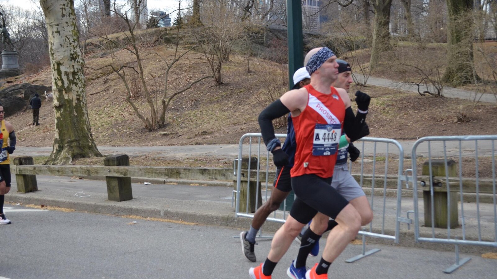 Chris Fischer racing the 2019 New York City Half in a red Prospect Park Track Club singlet