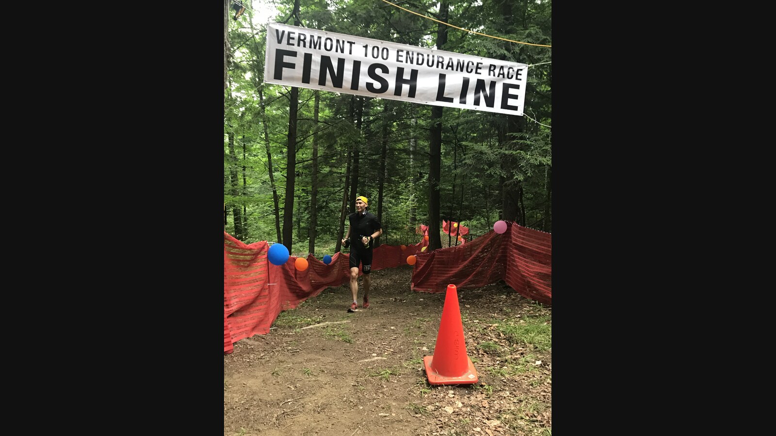 Chris crossing the Vermont 100 finish line early Sunday morning after running through the night