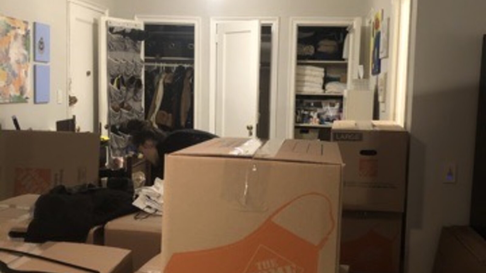 Moving boxes stacked inside Chris Fischer's apartment in February 2021