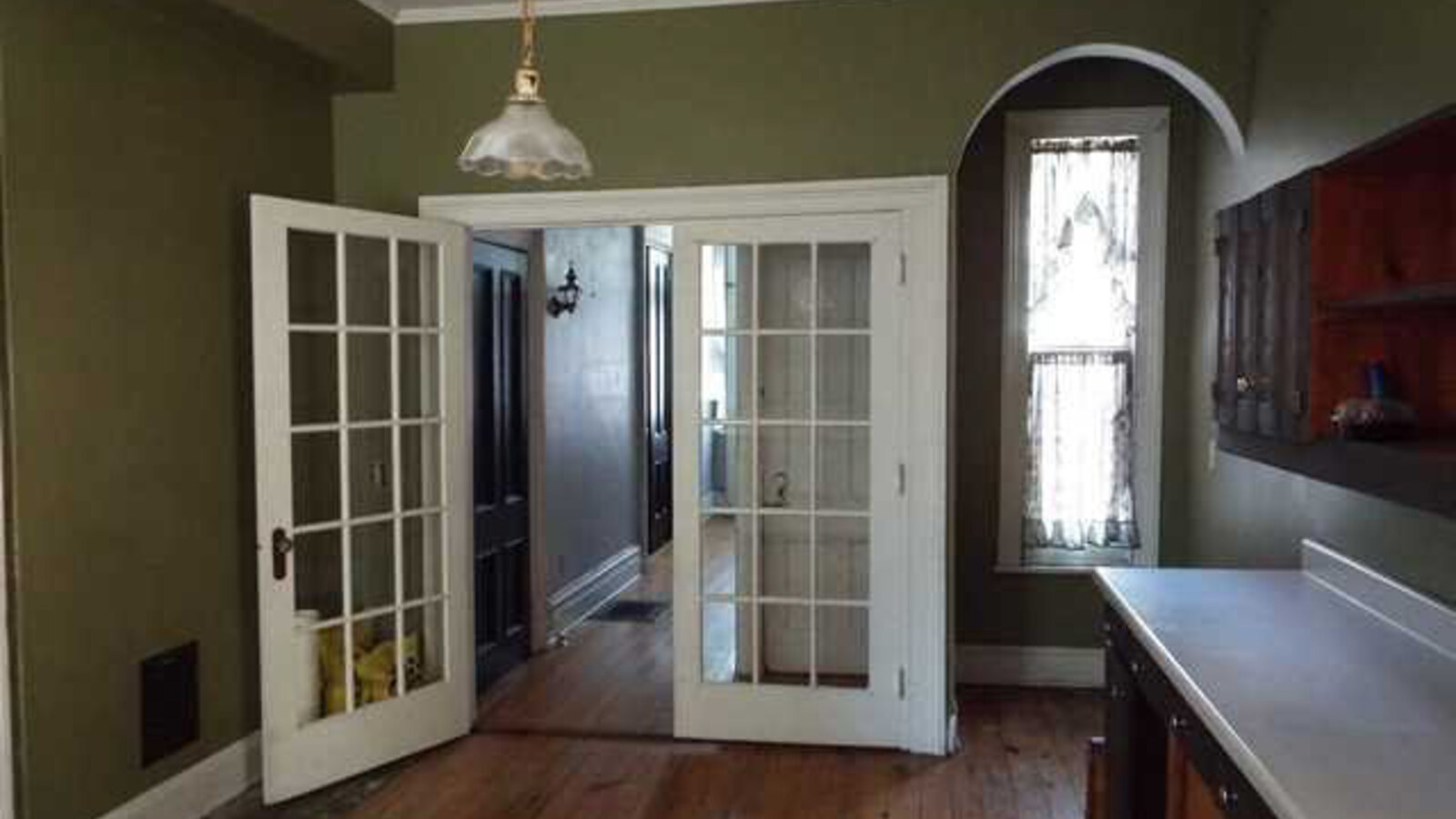 The worn kitchen and wood floors inside 134 Franklin Street before Chris Fischer's renovation