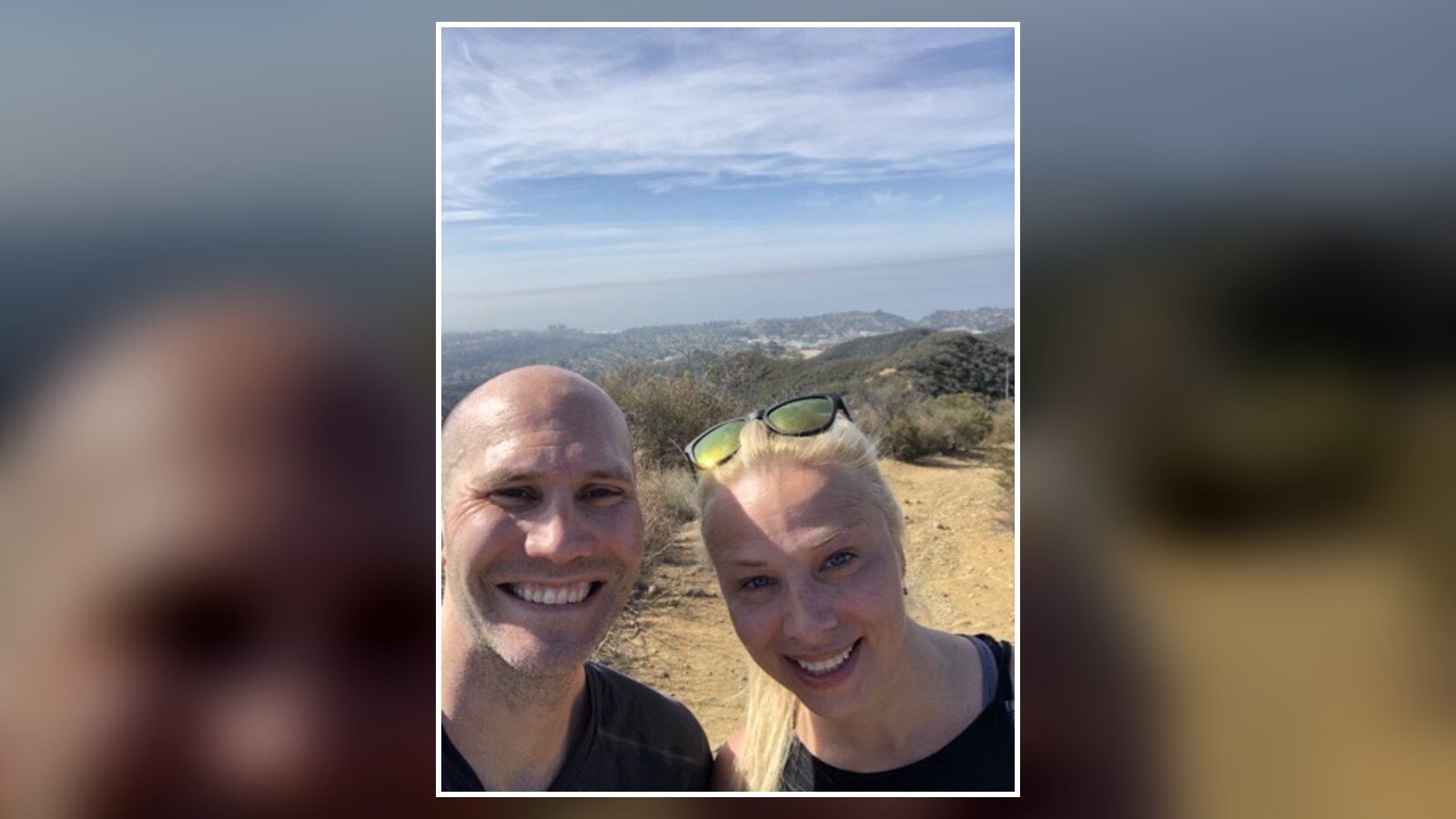 Chris Fischer and Amanda smiling on a sunny trail during the April 2021 California trip