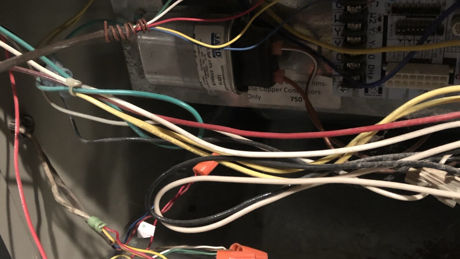 Open HVAC control panel and unfinished wiring at the Poughkeepsie house during its final repairs