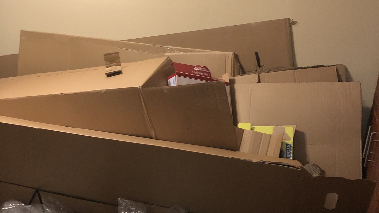A pile of flattened boxes and packing material inside Chris Fischer's Newport Beach apartment