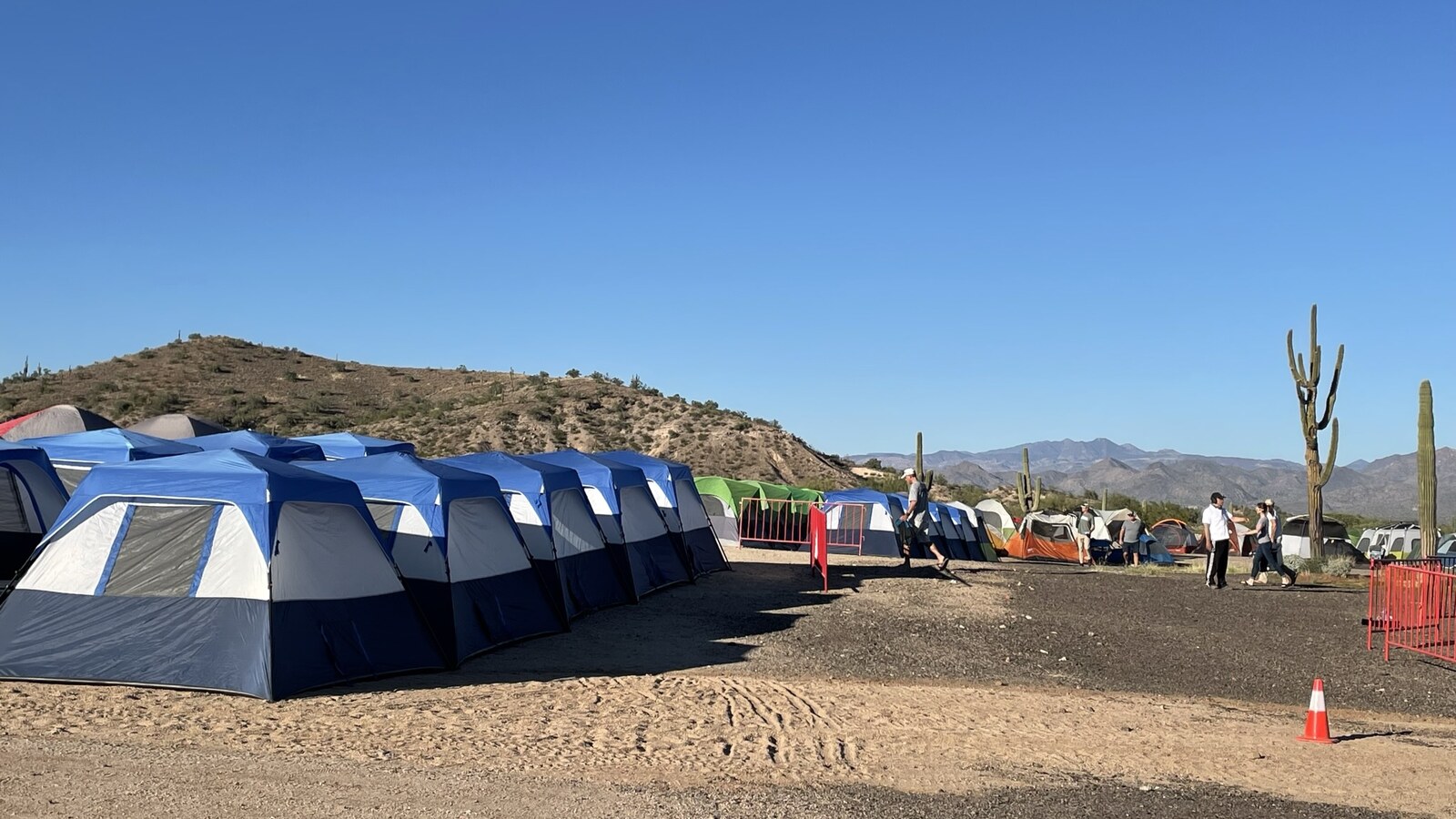 Rows of race tents beneath cactus-covered hills at Javelina in Arizona