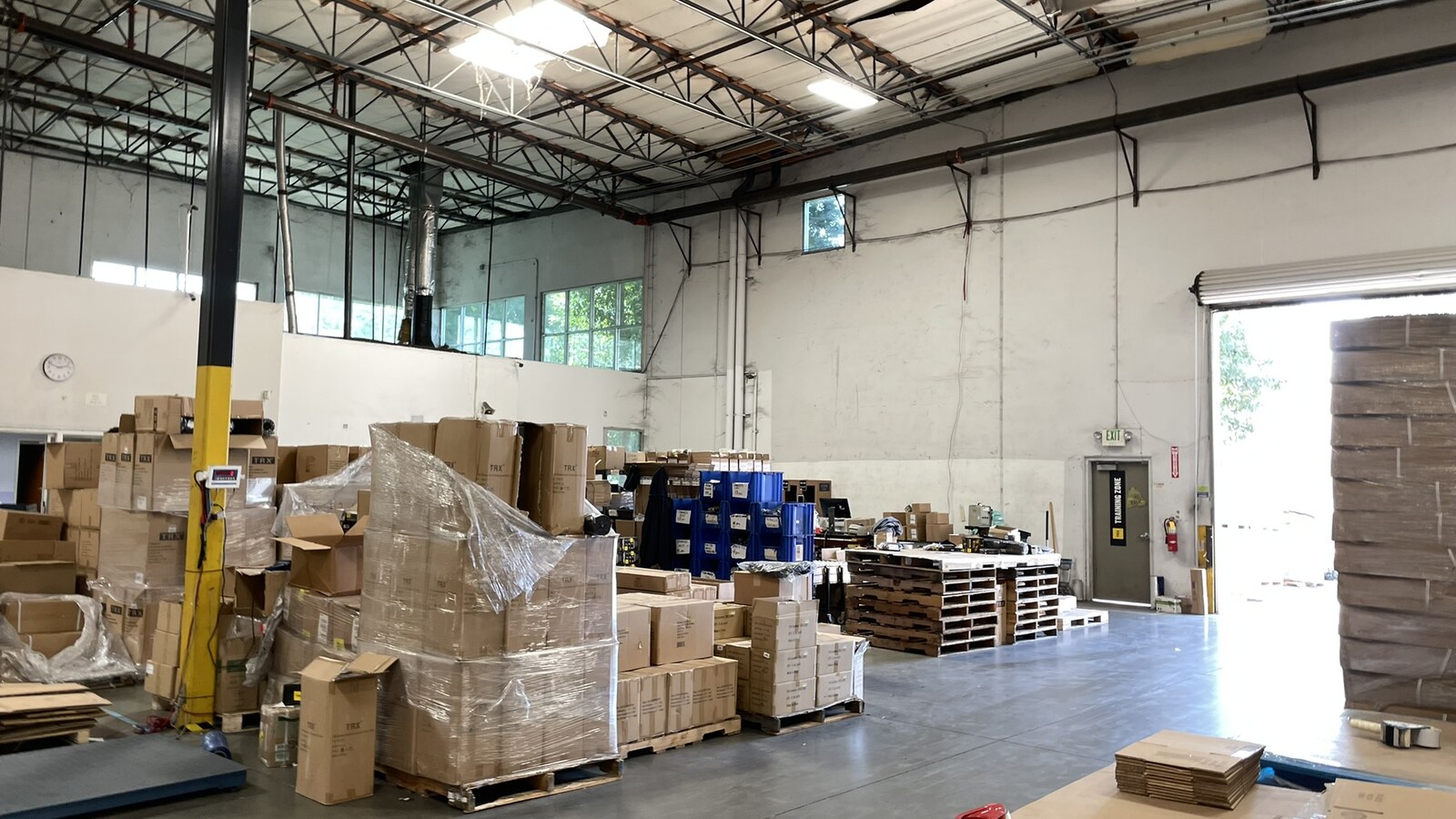 Pallets of boxed TRX equipment inside a Southern California warehouse
