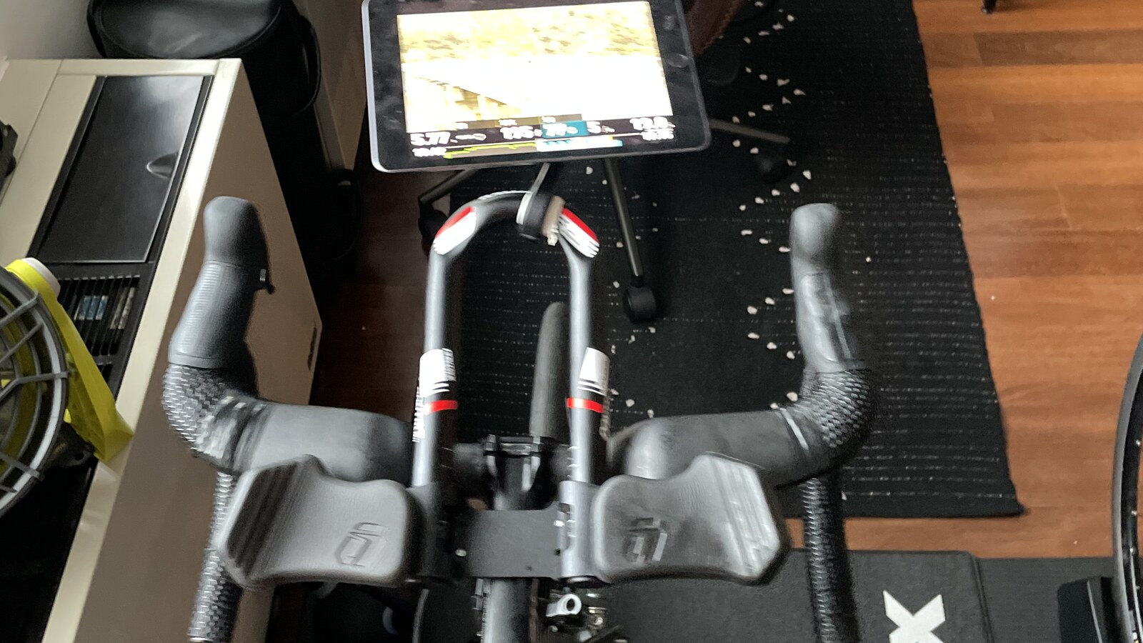 A time-trial bike and tablet set up for an indoor cycling workout