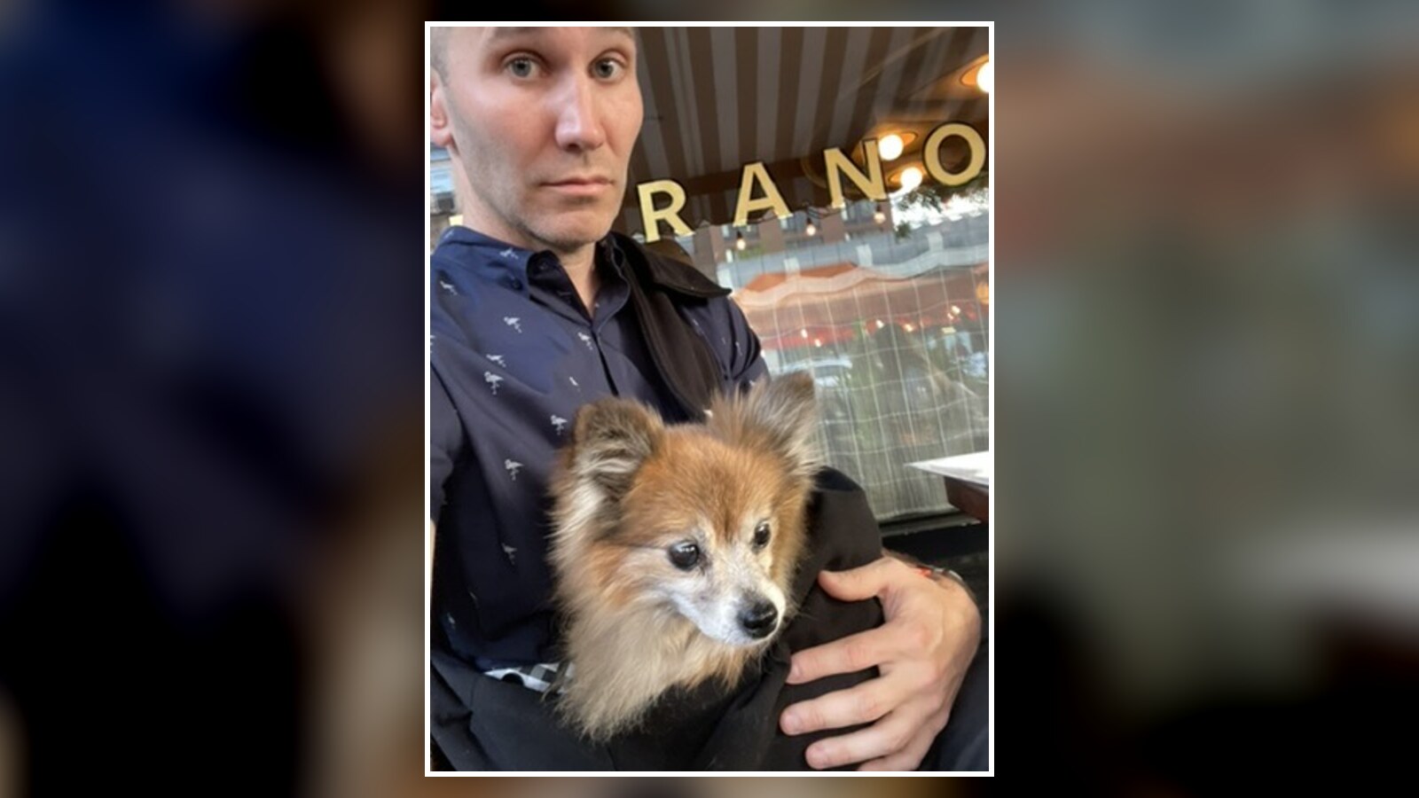 Chris holding Eva at a restaurant during a hectic week in May 2022