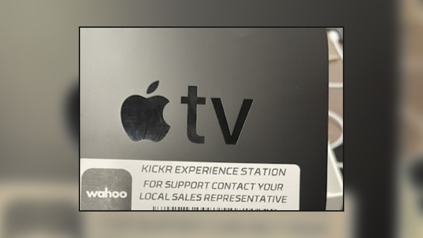 An Apple TV labeled for a Wahoo KICKR experience station, cropped to remove its serial number