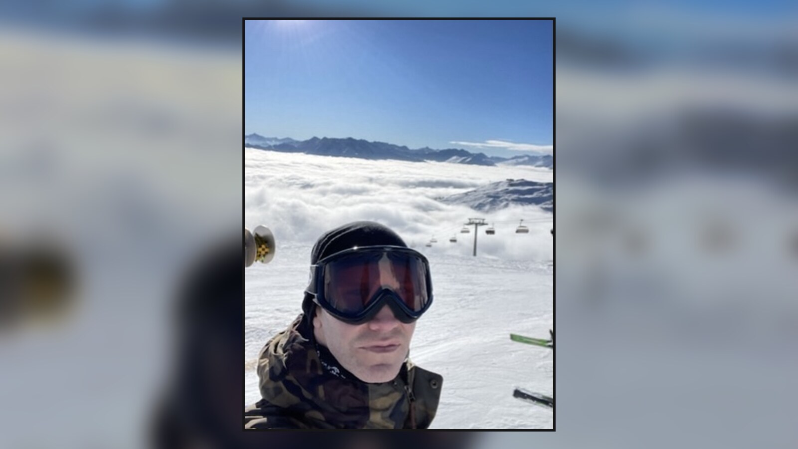 Chris wearing ski goggles above the clouds in Flims, Switzerland