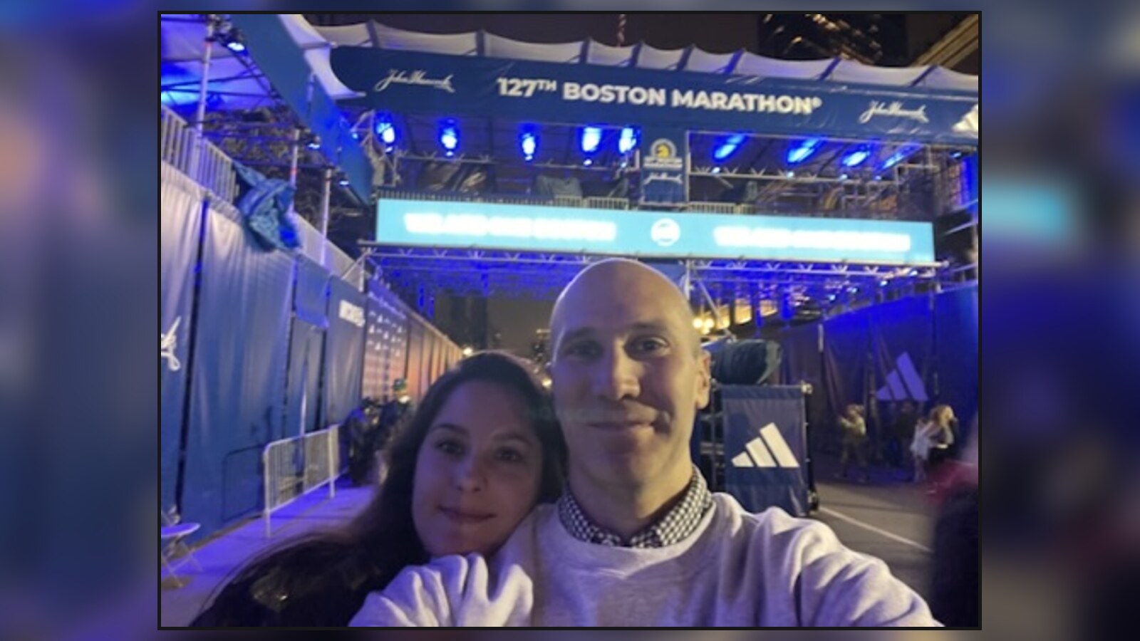 Chris and Amanda beneath the illuminated 127th Boston Marathon finish structure