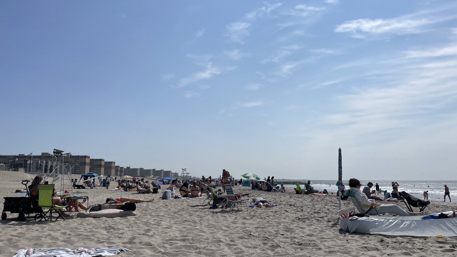 A busy spring afternoon on the sand at Rockaway Beach in Queens