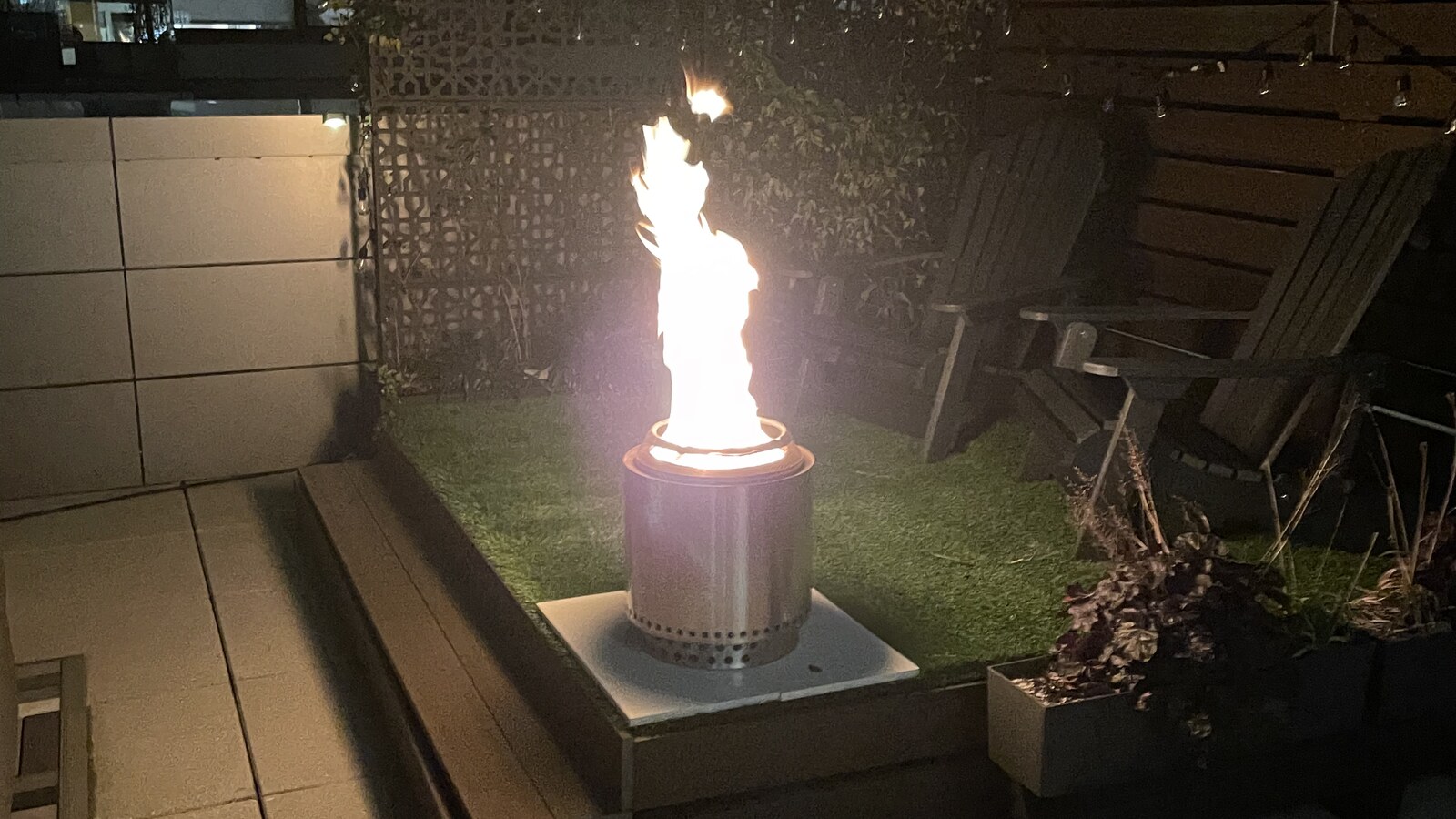 A tall flame burning in a small fire pit on the Rockaway terrace the night before Thanksgiving