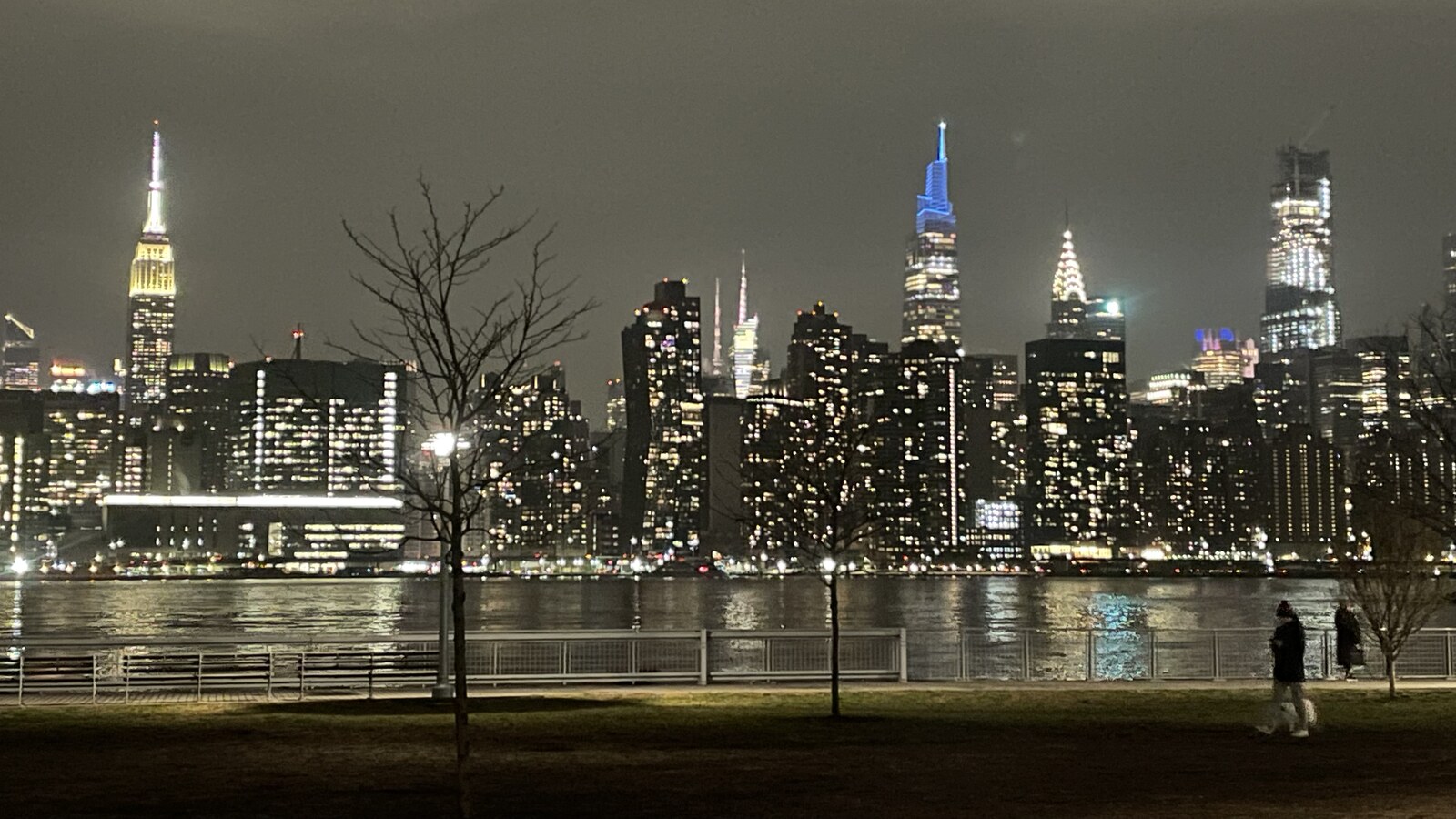 The Manhattan skyline at night viewed across the East River from Greenpoint