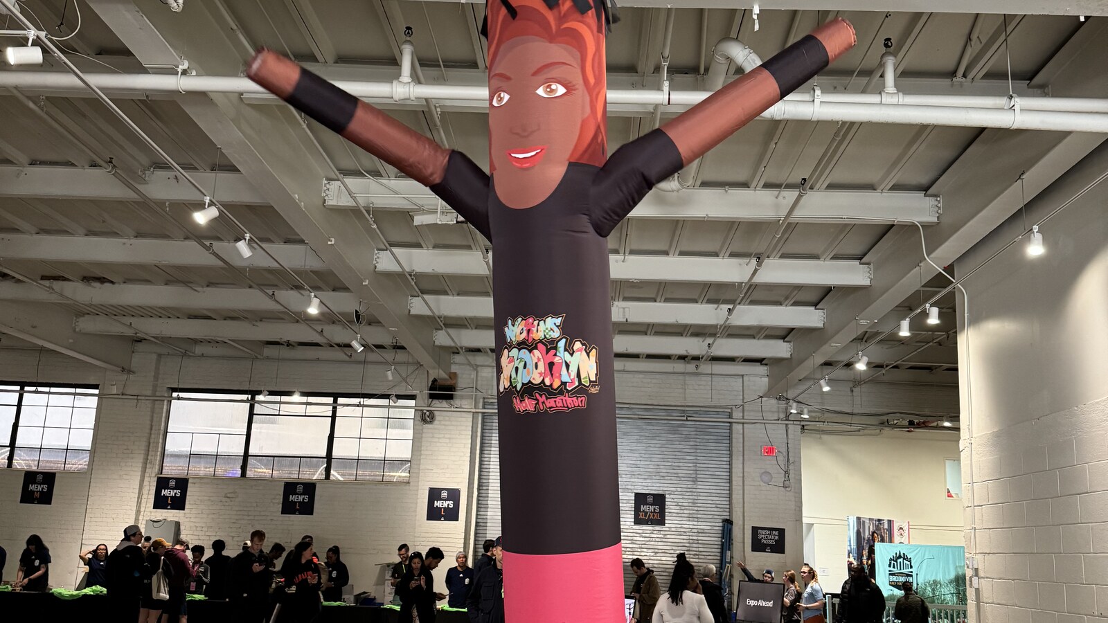 A giant inflatable runner at the NYCRUNS Brooklyn Half Marathon expo