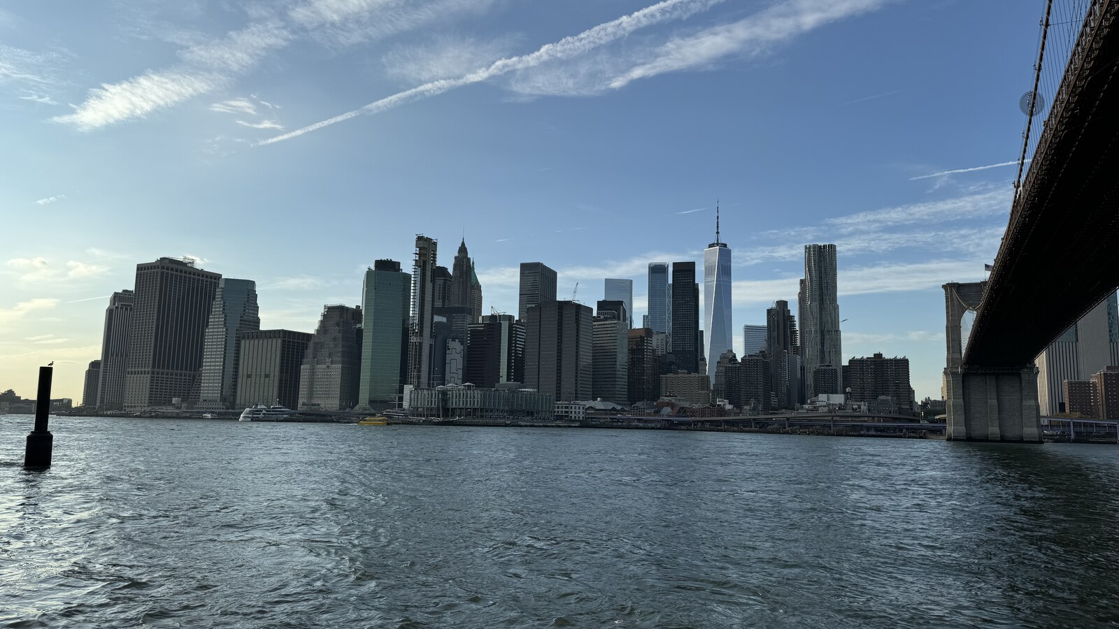 Lower Manhattan and the Brooklyn Bridge seen across the East River on a clear November afternoon